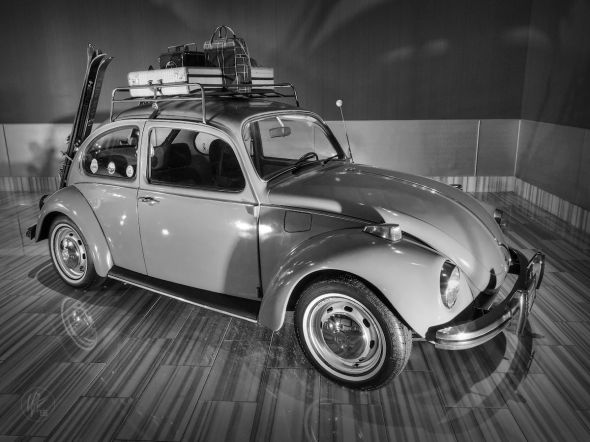 This is a 1971 Super Beetle complete with luggage rack, vintage luggage and skis located at the Flamingo Las Vegas. 